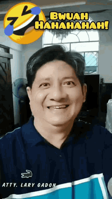 a man wearing a shirt that says atty lary gadon is smiling