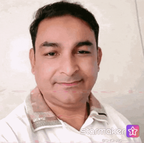 a man in a white shirt is smiling in front of a starmaker app