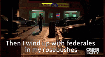a man standing in front of a los pollos hermanos restaurant at night