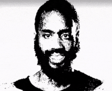 a man with a beard is shown in a black and white photo