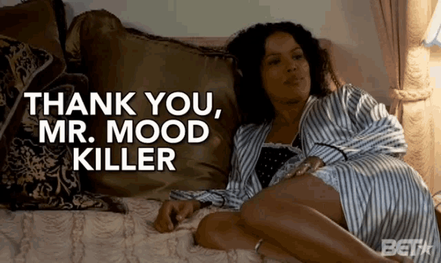 a woman is laying on a bed with the words thank you mr. mood killer