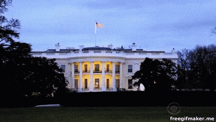 the white house is lit up at night with a freegifmaker.me watermark