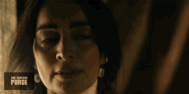 a poster for the forever purge shows a woman 's face