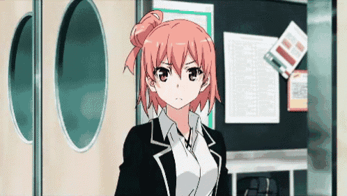 a girl with pink hair stands in front of a blackboard
