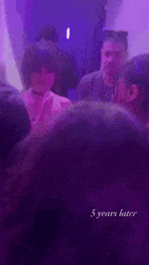 a purple background with the words 5 years later at the top