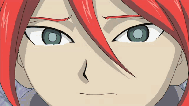 a close up of a cartoon character 's face with red hair and green eyes