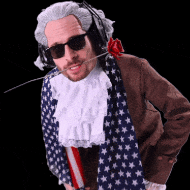 a man wearing a wig and sunglasses is holding a flag
