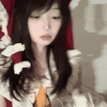 a woman with long hair is holding a bunch of toilet paper