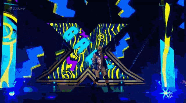 a woman stands on a stage with a glowing star in the background and the words # duallive on the bottom right