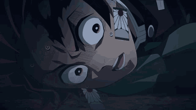 a close up of a person 's face with a shocked look on their face