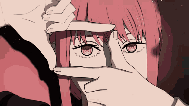 a close up of a person making a frame with their fingers