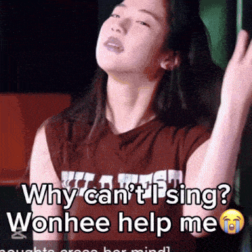 a woman in a brown shirt says why can 't sing wonhee help me