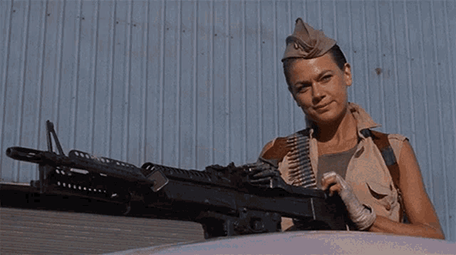 Hell Comes To Frogtown Girl With Gun GIF - Hell Comes To Frogtown Girl With Gun Big Gun GIFs