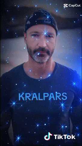 a man with a beard wearing a shirt that says kralpars