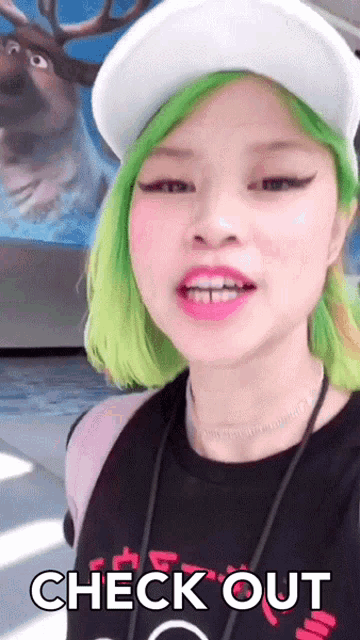 a woman with green hair says check out