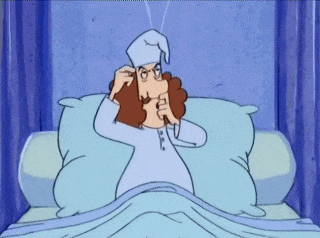 a cartoon of a man laying in bed with a sleep cap on his head