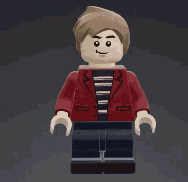 a lego man wearing a red jacket and a striped shirt