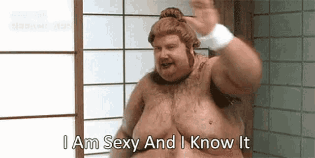 a shirtless fat man in a wig is standing in a bathroom and says `` i am sexy and i know it '' .
