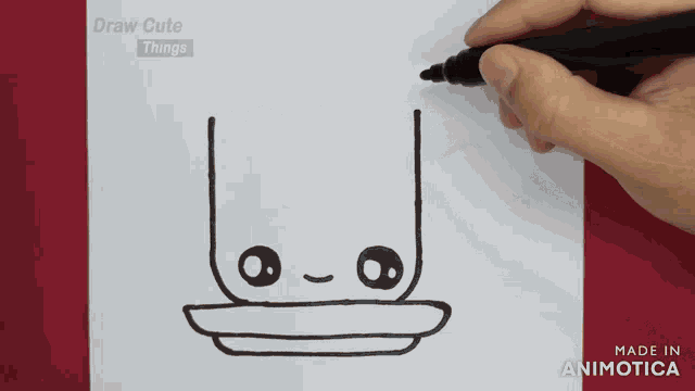 a person is drawing a cartoon character on a piece of paper with the words draw cute things above it