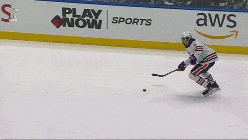 a hockey game is being played in front of a pepsi banner