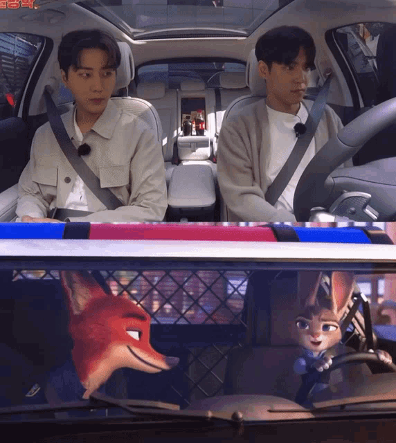 two men are sitting in a car with a cartoon character in the back