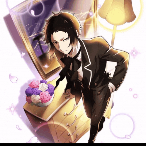 a man in a tuxedo stands in front of a dresser with flowers in it