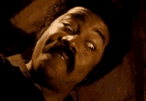 a man with a mustache is making a funny face with the words " muthafuckaaaa " written on the bottom