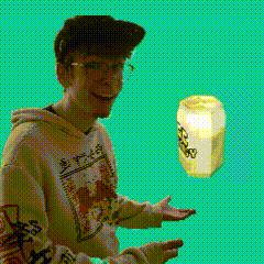 a man in a hoodie is holding a jar of honey in his hands