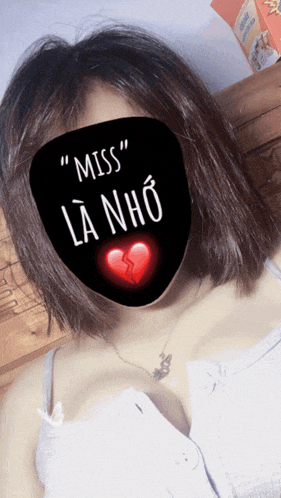 a woman is wearing a mask that says miss la nho on it