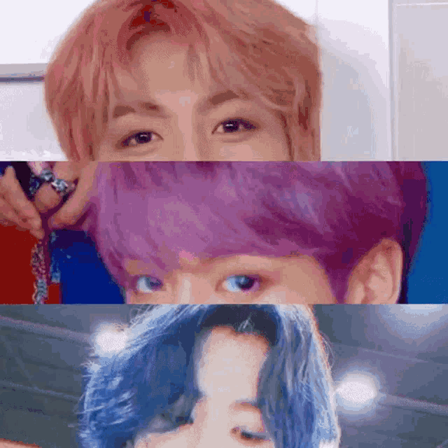 a close up of a person 's face with pink , purple and blue hair