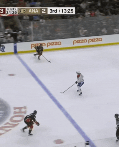 a hockey game is being played and the score is 3-2
