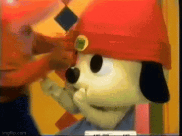 a close up of a cartoon character wearing a red hat on a yellow background .
