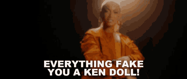 a woman in an orange suit is dancing and says everything fake you a ken doll