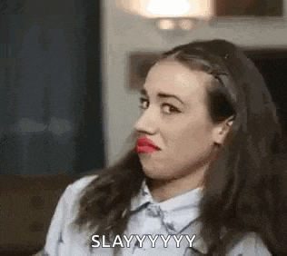 a woman with red lipstick on her lips is making a funny face and saying slay .