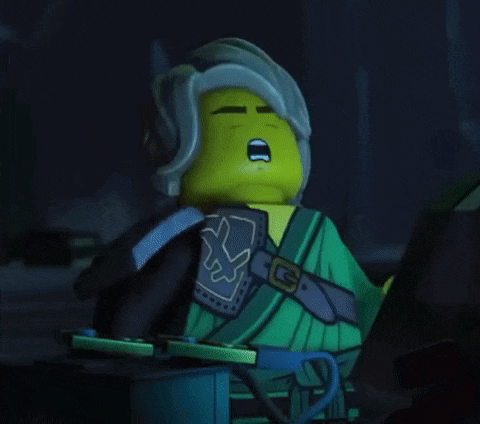 a close up of a lego ninjago character holding a sword in his hand .