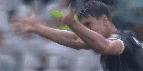a man in a black shirt with the number 7 on the back