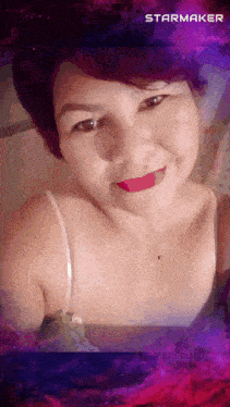 a woman taking a selfie with a starmaker watermark