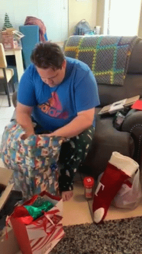 Opening Presents Removing The Wrap GIF