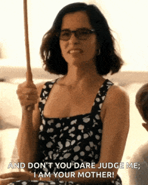 a woman holding an umbrella says " and don t you dare judge me "