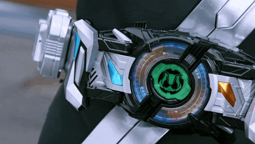 a close up of a mechanical device with a green circle in the middle