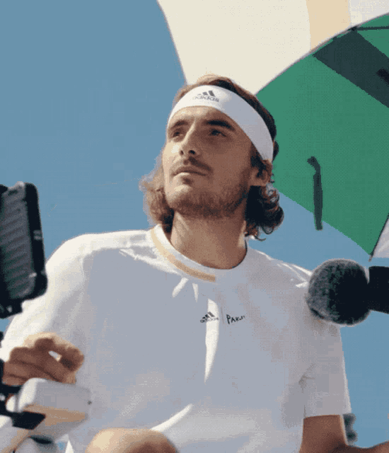 a man wearing a headband that says adidas