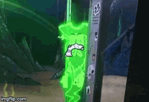 a green glowing object is coming out of a wall .