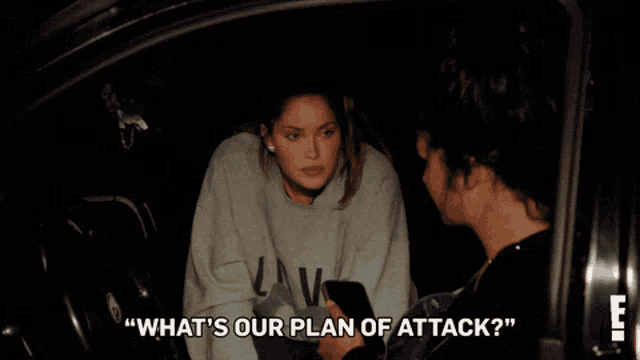 a woman talking to a man with the words " what 's our plan of attack "