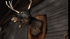 a man in a video game is standing in front of a wall .