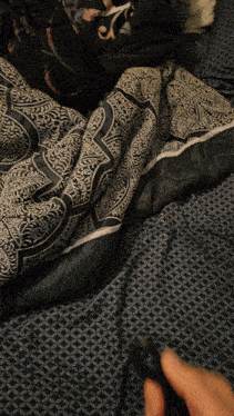 a black and white blanket with a geometric pattern