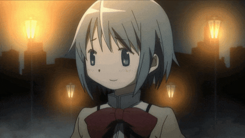 a girl with short hair and a red bow on her head