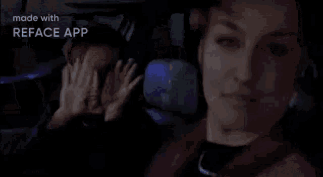 a man and a woman are sitting in a car . the man is making a funny face .