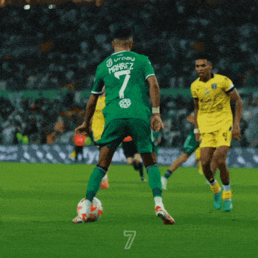 a soccer player wearing a green shirt with the number 7 on the back