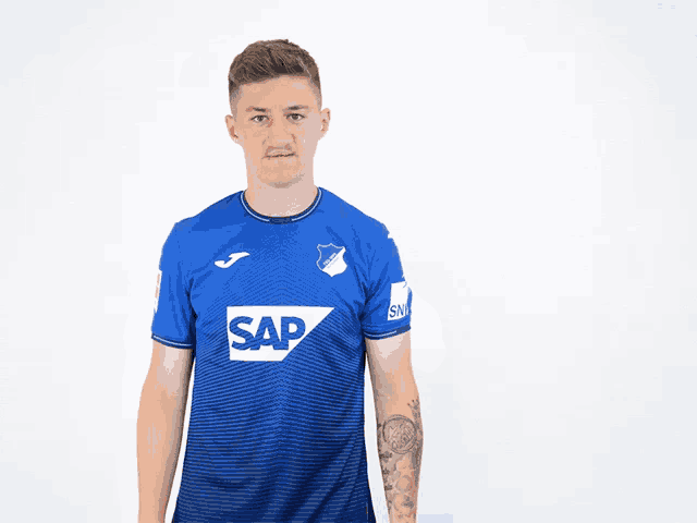 a man in a blue shirt with sap on it
