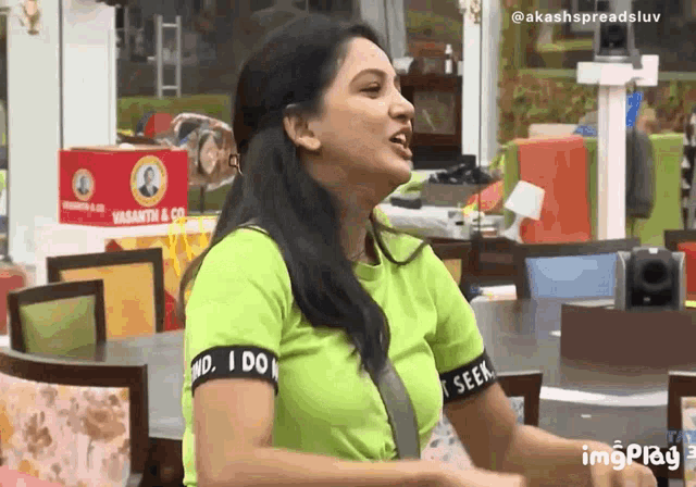 a woman wearing a green shirt that says " i do n't seek "